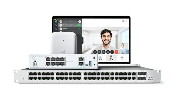 Cisco Catalyst switch beside a laptop on a video call