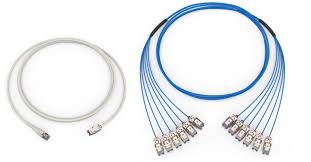 Cat6 patch cord beside a fanned-out fiber trunk assembly